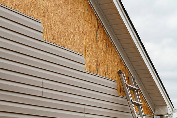 Professional Siding technician working in Corning, NY